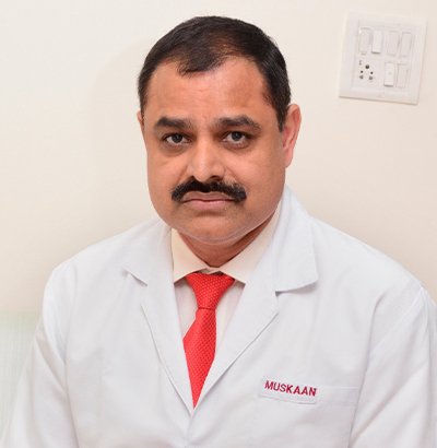 Dr. Suresh Ahlawat — leading dentist in Gurgaon, BDS MDS DNB USA, founder of Muskaan Dentals